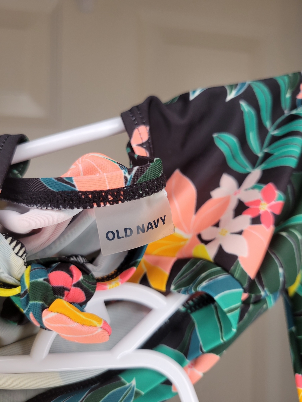Old Navy toddler girl's long-sleeve, one-piece swimsuit featuring a black floral - Picture 2 of 6